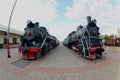 Photo of old black steam locomotives of the Soviet Union. Strong distortion from the fisheye len