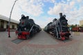 Photo of old black steam locomotives of the Soviet Union. Strong distortion from the fisheye len Royalty Free Stock Photo