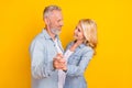 Photo of old cheerful positive people couple dance good mood enjoy harmony love isolated on yellow color background Royalty Free Stock Photo