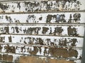 A photo of an old garage door with the paint chipping and the metal rusting, in need of repair Royalty Free Stock Photo