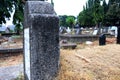 Photo of an old grave with grass on the left and right