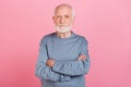 Photo of old grey hairdo man crossed arms wear blue shirt isolated on pink color background Royalty Free Stock Photo