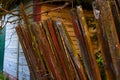 Photo of an old leaning wooden fence. Barn.