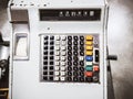 Photo of an old Soviet cash register with buttons and numbers and with paint peeling off from old age on the case Royalty Free Stock Photo
