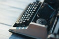 Photo of old typewriter on wooden table in sunset light, retro look. Royalty Free Stock Photo