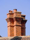Victorian chimney stack roof rooftop bricks old red pot houses house home tiles architecture Royalty Free Stock Photo