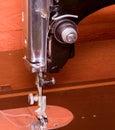 Photo of an old vintage hand sewing machine. Selective focus. Macro image with gloomy effect. Royalty Free Stock Photo