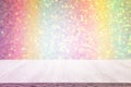 Photo of old wooden table in front of pastel rainbow glitter lights background. Ready for product display montage Royalty Free Stock Photo
