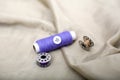 Photo of One thread, button and one bobbin on the cloth Royalty Free Stock Photo