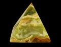 Photo of Onyx natural mineral stone pyramid Russian, with ground, polished surfaces Isolated On Black Background Royalty Free Stock Photo