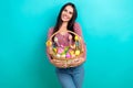 Photo of optimistic girl celebrate easter spring holiday event holiday hold bucket with painted eggs gingbread isolated Royalty Free Stock Photo