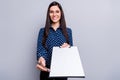 Photo of optimistic girl give paper wear spectacles blue blouse isolated on grey color background