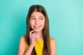 Photo of optimistic nice brown hair girl look empty space wear yellow dress isolated on bright teal color background Royalty Free Stock Photo