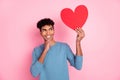 Photo of optimistic nice brunet guy look heart wear blue sweater isolated on pastel pink color background