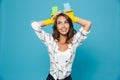 Photo of optimistic smiling housewife 20s in yellow rubber glove