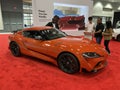 Orange Toyota Supra Sports Car at the Auto Show