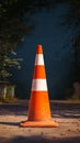 Photo Orange and white street cone against natural background, caution symbol