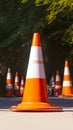 Photo Orange and white street cone against natural background, caution symbol