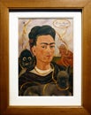 Photo of the original painting `Self-portrait with Small Monkey` by Frida Kahlo