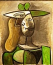 Photo of the original painting `Woman in a Green Hat` by Pablo Picasso, frameless. Royalty Free Stock Photo