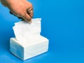 Photo a pack of white tissue against blue background.