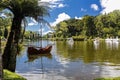 Paddle boat on the Black Lake of Gramado city, Rio Grande do Sul - Brazil, on a sunny day with sky with clouds Royalty Free Stock Photo