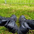 photo of a pair of black shoes on the grass Royalty Free Stock Photo