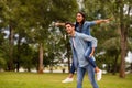 Photo of pair flying away together at summer green street spread arms sides wear denim outfit