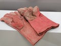 Photo of a pair used welding hand glove.