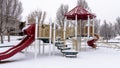 Photo Panorama frame Colorful playground for children at a park covered with snow at winter season Royalty Free Stock Photo