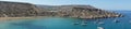 Photo panorama. A look at Il-Qarraba promontory at Ghajn Tuffieha Bay.