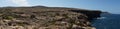 Photo panorama. Magnificent rocky Mediterranean coastline. Triq Tal-Prajjet, Il-Mellieha, Malta.