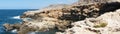 Photo panorama. Magnificent rocky Mediterranean coastline. Triq Tal-Prajjet, Il-Mellieha, Malta.