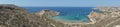 Photo panorama. Magnificent views of Riviera Beach and the small watchtower Ghajn Tuffieha Tower, Mellieha, Malta. Royalty Free Stock Photo