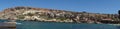 Photo panorama. Popeye Village, also known as Sweethaven Village, is located in Anchor Bay. Triq Tal-Prajjet, Il-Mellieha, Malta. Royalty Free Stock Photo