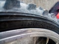 Part of a child mountain bike tire with the markings of the tire dimensions in ETRTO standard