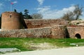 Photo with a part of the wall surrounding the historic part of the city of Iznik with the ruins of an ancient towers