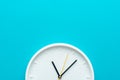 Photo of part of white wall clock over turquiose blue background with copy space Royalty Free Stock Photo