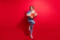 Photo of party atmosphere merry christmas vibe jumping received delivery from santa claus girl surprise isolated on red Royalty Free Stock Photo