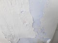 photo of peeling white wall paint