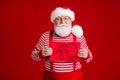 Photo of pensioner grandpa grey beard serious hold paper placard wanted thief stolen present wear santa costume