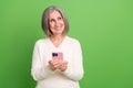 Photo of pensioner old woman wear white pullover hold gadget order eshopping proposition look mockup isolated on grey