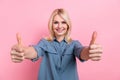 Photo pensioner pretty lady raise hands arms thumbs up agree success deal wear blue smart casual blouse isolated pink