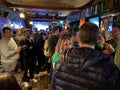 People Enjoying Saint Patricks Day at a Bar in March in Washington DC Royalty Free Stock Photo