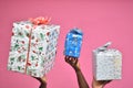 photo of people holding up gift boxes and present over their heads, hands only Royalty Free Stock Photo