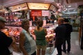 Shopping for Fine Hams and meats for Sale at a Shop in Madrid Spain