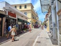 Photo of people walking on Vyronos street in the picturesque neighborhood of Plaka in Athens, Greece. Royalty Free Stock Photo