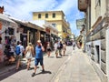 Photo of people walking on Vyronos street in the picturesque neighborhood of Plaka in Athens, Greece. Royalty Free Stock Photo