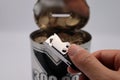 Close-up of a person holding a can opener Royalty Free Stock Photo