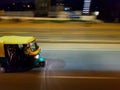 A fast moving auto rickshaw in Bangalore Highways